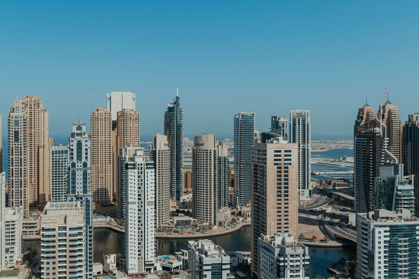 Dubai skyline with modern skyscrapers under a clear blue sky
